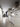 White marble kitchen counter with hood, viewed down a hallway