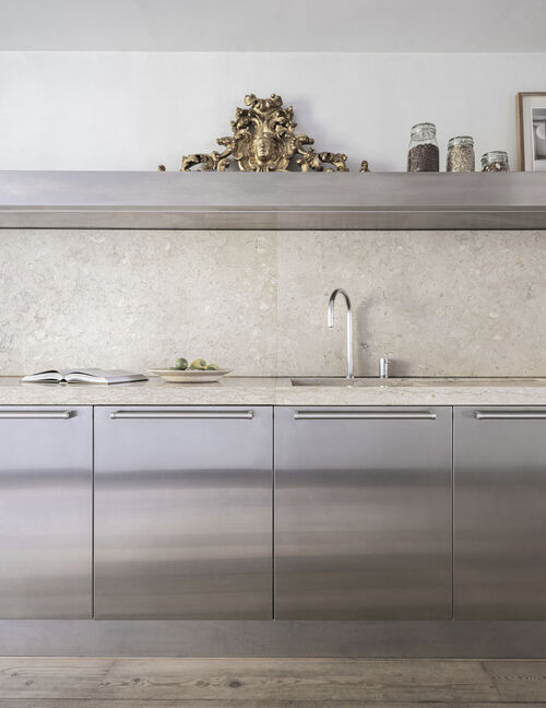 Arclinea Artusi kitchen detail with stainless steel fronts and stone worktop