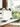 Arclinea kitchen countertop with hood and view of garden through glass wall