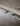 Arclinea Artusi kitchen close-up showing integrated stone sink and steel handles