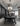 Arclinea showroom with black dining table, sphere chandelier and dark cabinetry