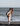 Aleandro playing with his kid in front of the sea
