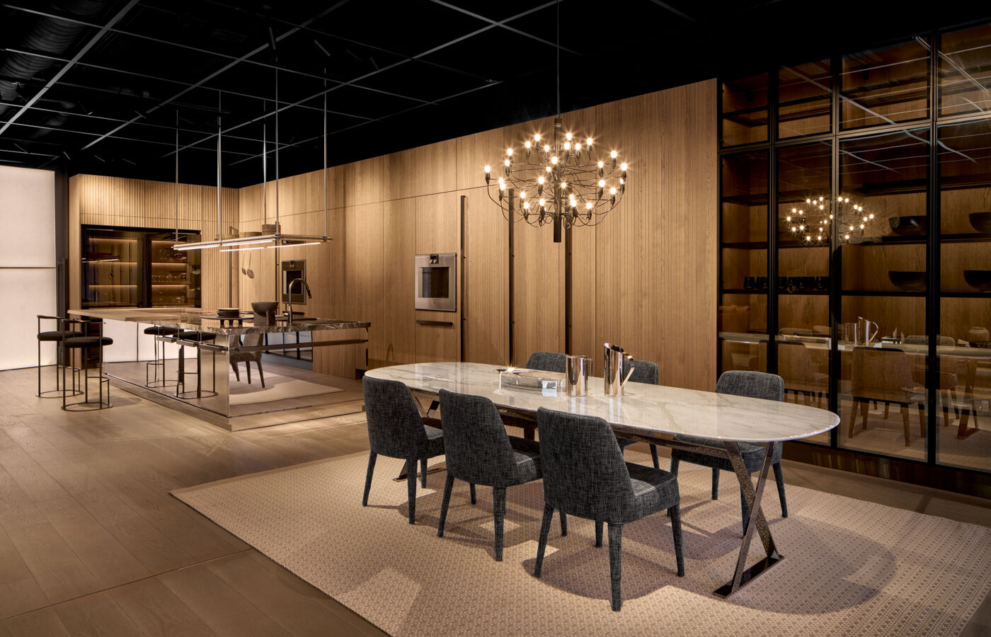 Arclinea Proxima kitchen open space with dining area, chandelier and wood finishes