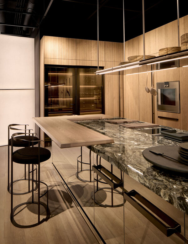 Arclinea Proxima kitchen island with marble surface, snack counter and metal stools