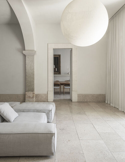 Bright living room connected to Arclinea Artusi kitchen in renovated heritage home