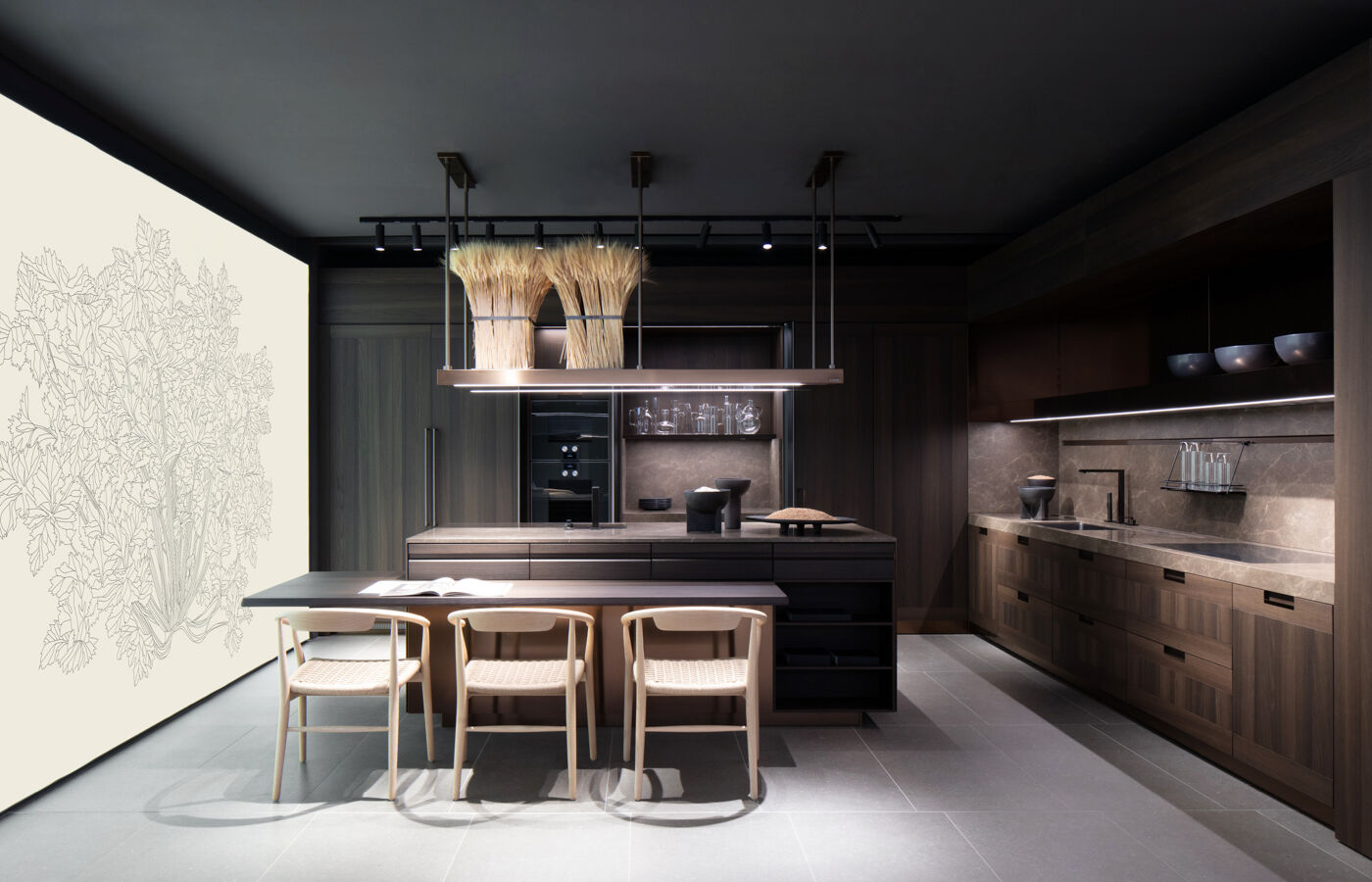 Arclinea kitchen island with a wheat-sheaf centerpiece staged against a wall with a hand-drawn botanical mural in the Brompton Road showroom