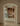 Arclinea kitchen Convivium with arched entry and warm wood cabinetry, minimalist island